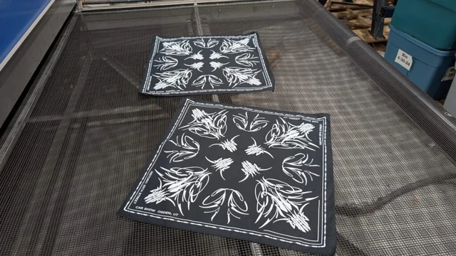 Custom printed bandannas displayed in bulk, ideal for promotional events and brand giveaways.